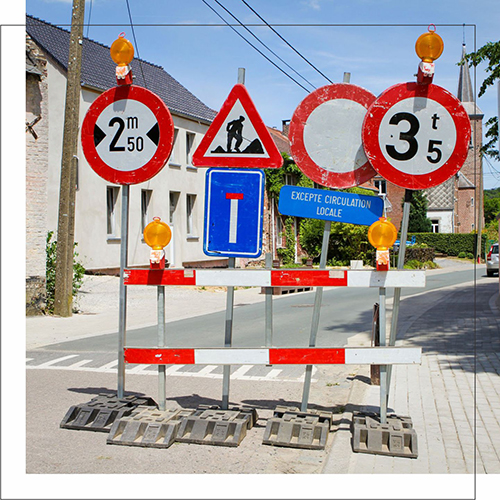 Directional signboard guiding visitors with clear arrows and instructions.